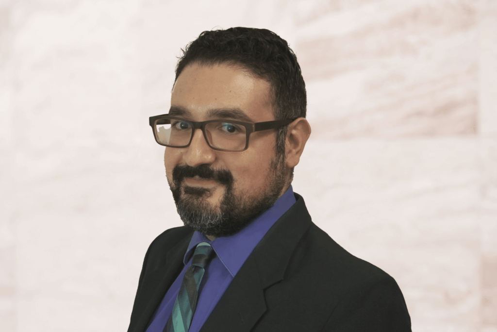 Peter Sayadzad, associate attorney at Bryan Fagan, PLLC, in professional attire, emphasizing family law expertise, with a friendly demeanor against a neutral background.