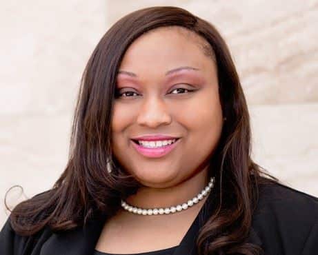Jessica Horace, family law attorney at Bryan Fagan, PLLC, smiling in professional attire, showcasing her expertise and approachable demeanor.