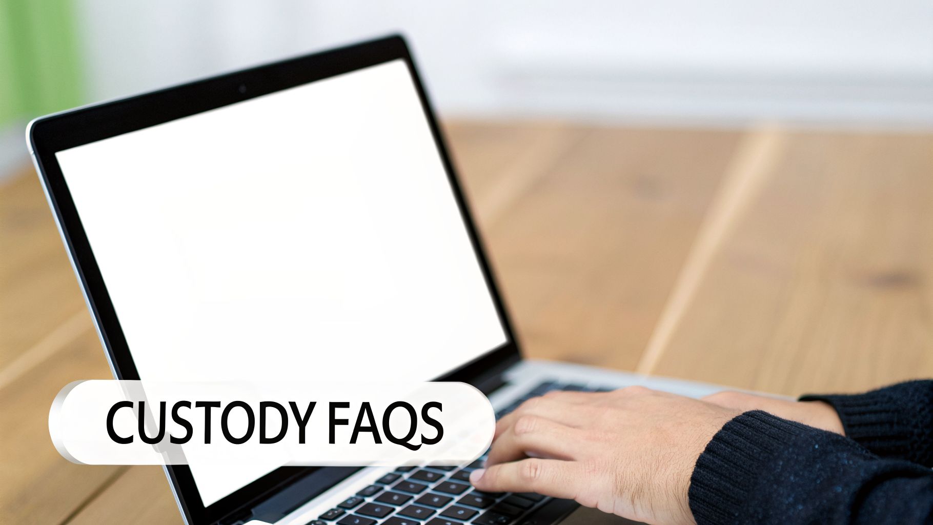Hands typing on a laptop with a blank screen and a speech bubble displaying 'CUSTODY FAQS'.
