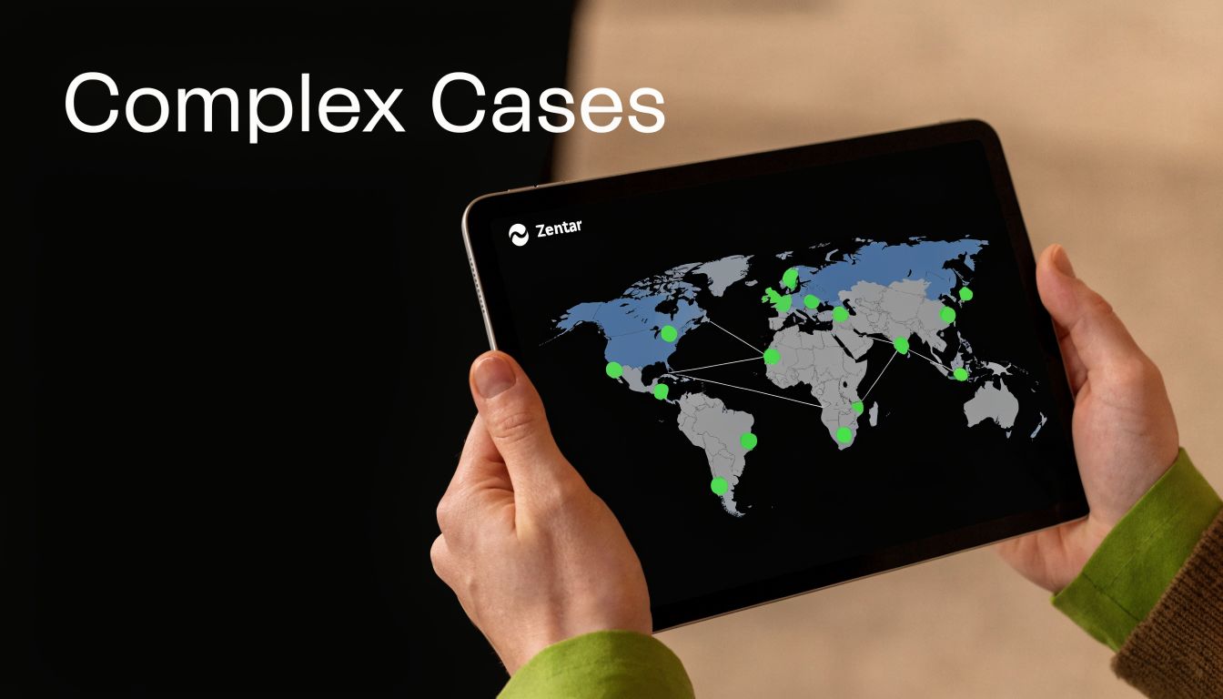 A person holding a tablet displaying a global digital map with network nodes and connections.