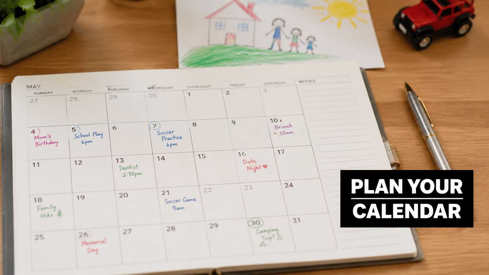 A monthly calendar for May with various activities and events written on specific dates on a wooden table.